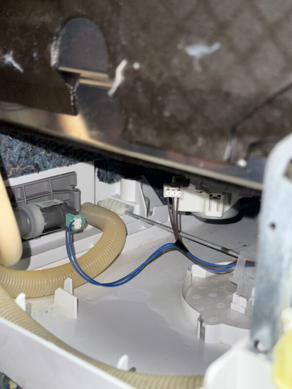Dishwasher pulled out—water in the tray triggered the sensor.