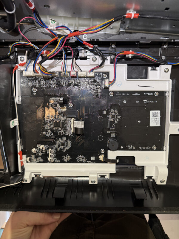 Control board panel with wiring connections visible.
