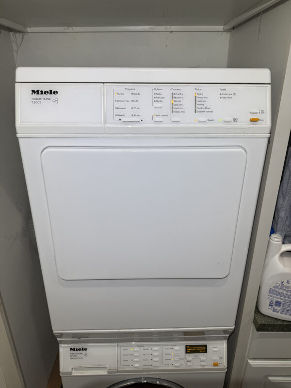Full view of the stacked Miele dryer.