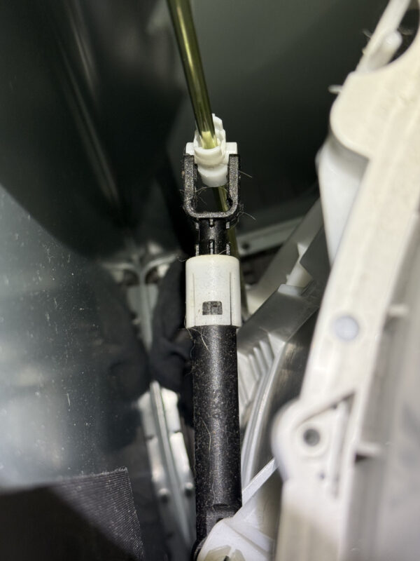 The black shock absorber needs to fit into the suspension rod.