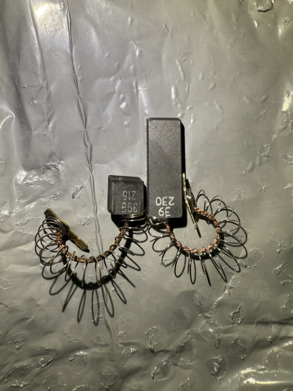 Motor brush comparison — old on the left, new on the right. Notice the wear on the old one.
