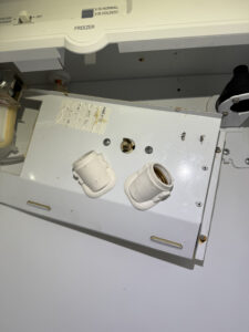 Trim panel removed, thermostat accessible