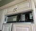 Refrigerator before repair, control panel removed